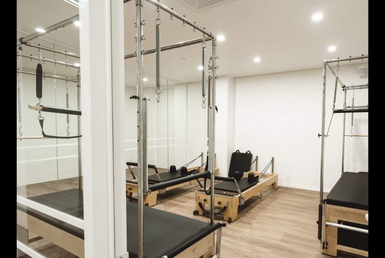 Clinical Pilates studio at All for One Hampton East with reformers and trapeze tables