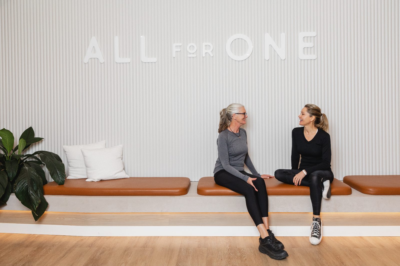 Members and the front desk at All for One