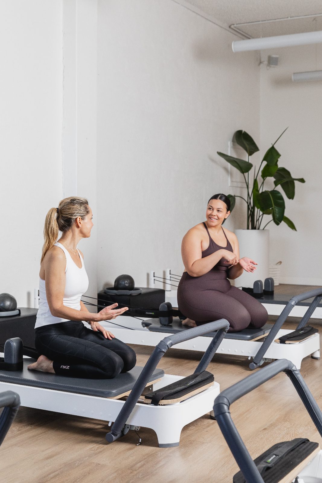 A first-timer being set up on a reformer at All for One