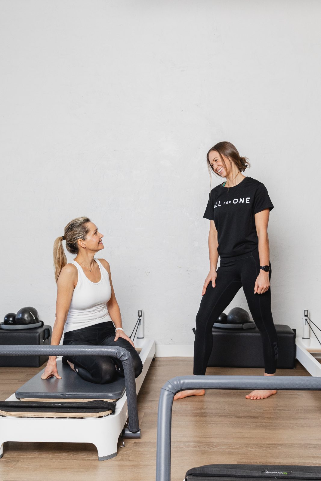 All for One members talking after a Reformer Pilates class